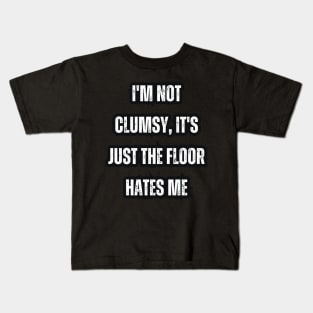 I'm not clumsy, it's just the floor hates me Kids T-Shirt